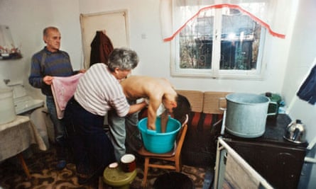 Jela and Zijo Dzino in 1995, washing their ill son Nermin