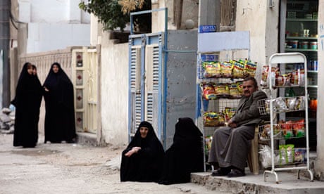 Shia and Sunni Muslims in the primarily Shiite neighbourhood of Hurriyah, north Baghdad