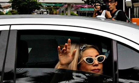 Lady Gaga waves to fans in Singapore, a stop on her Asian tour.