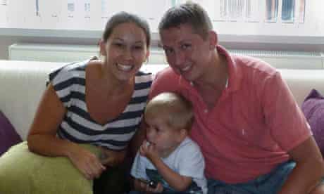 Emma and Paul Marshall with one of their two children at home in Birmingham.