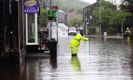 Floodwaters surround houses and shops in Hebden Bridge, West Yorkshire.