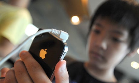 A South Korean boy uses an iPhone 4