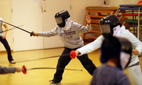 Children participate in fencing lessons