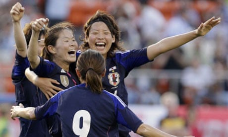 Japan's Sawa reacts with her teammates