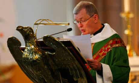 Catholic priest at a lectern