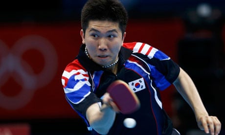 South Korea's Ryu Seungmin wielding table tennis bat