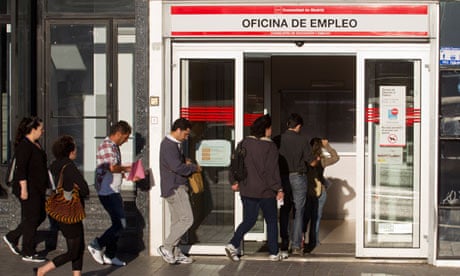 People queue outside an job centre in Madrid