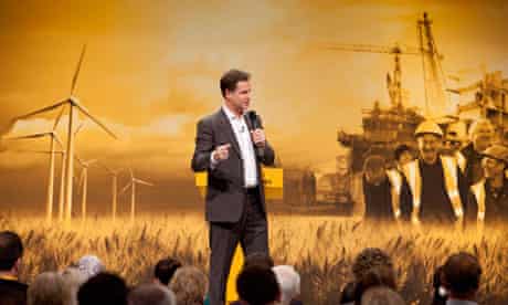 Nick Clegg takes questions at the Liberal Democrat conference, with a green growth backdrop.