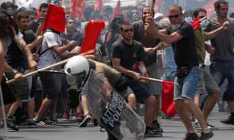 Greek rioters beat policeman