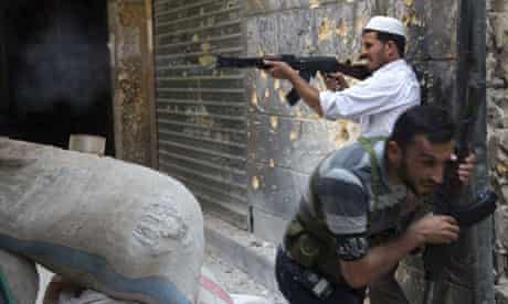 A Syrian rebel fires towards regime forces in Aleppo