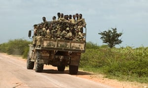 Ethiopian soldiers ride an army vehicle
