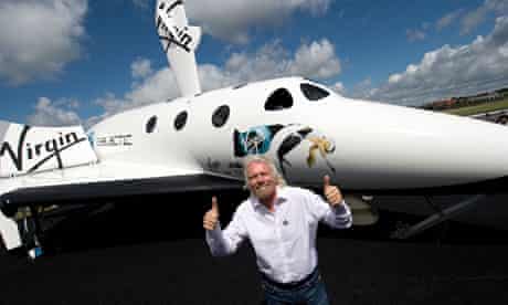 Richard Branson with a model of Virgin Galactic