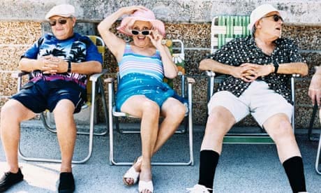 Pensioners sit on deckchairs 