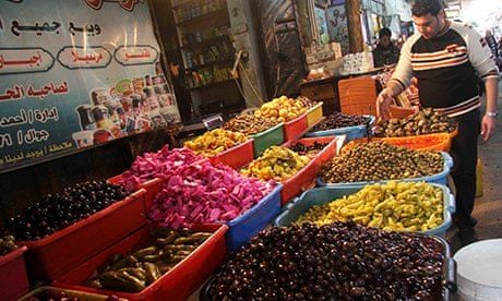 A vendor sells pickles at al-Zawiya market in Gaza City