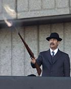 Secrets: Saddam Hussein fires shots into the air on December 31, 2000