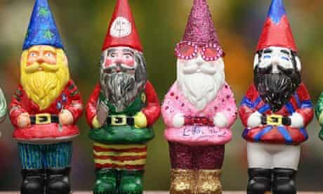 Four brightly coloured garden gnomes
