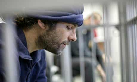 Iain Rogers, Greenpeace activist, in a cage in court
