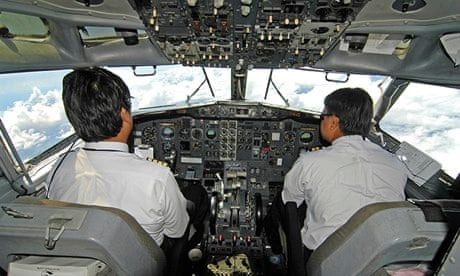 A pilot and co-pilot in a civilian aircraft cockpit