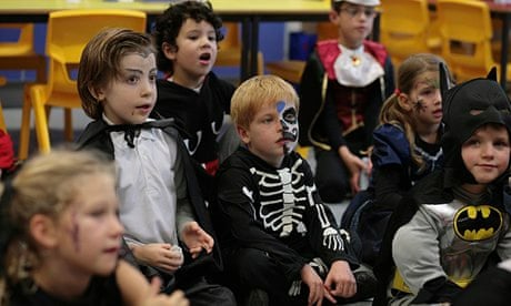 young children dressed as skeletons and vampires