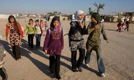 Bedouin children walk to school in the Negev desert