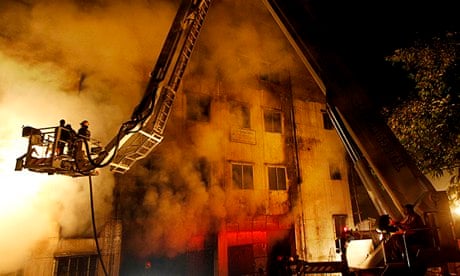 Bangladeshi firefighters battle a fire at Tazreen garment factory in Savar