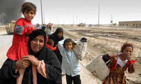 A family of Iraqi civilians fleeing Basra in southern Iraq in March 2003.