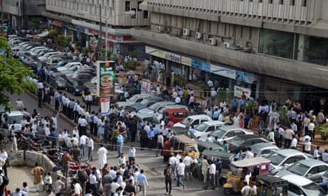 People are evacuated from buildings following tremors in Karachi