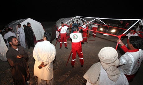 Iranian Red Crescent workers erect tents 