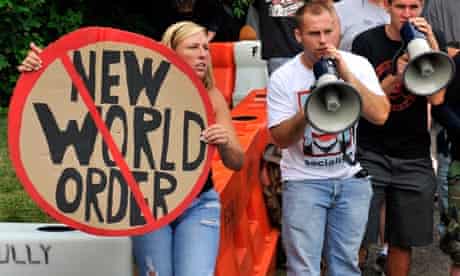 Protestors with placards and megaphones at Bilderberg 2012