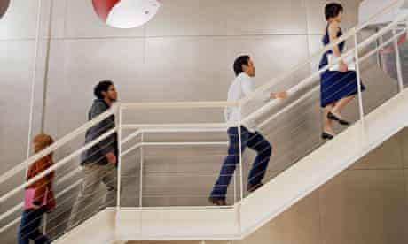 Business people walking up stairs