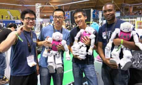 Students from the University of Pennsylvania's UPennalizer team show off their robot