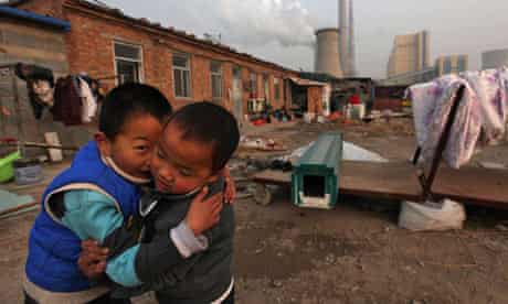 Chinese boys play near their home in Beijing.