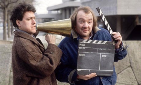 Mel Smith and Griff Rhys-Jones with megaphone and clapperboard on South Bank, London