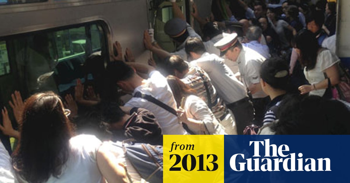 Japanese passengers move 32-tonne train to rescue trapped woman