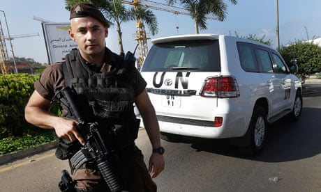 A Lebanese soldier watches as the UN experts arrive at Beirut international airport.