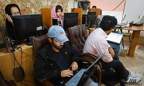 Customers at a Tehran internet cafe