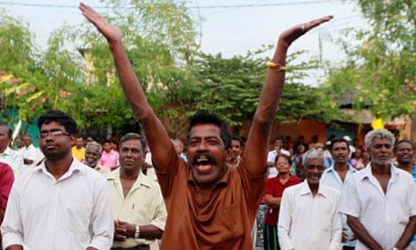 man cheers at a rally in Jaffna