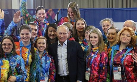 Vladimir Putin poses with Sochi Winter Olympics volunteers