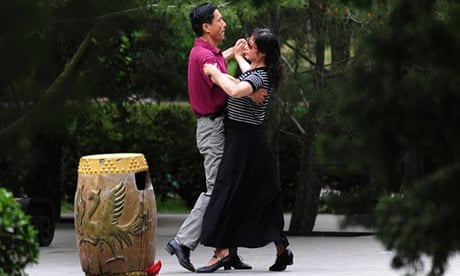 A couple ballroom dancing at park in Beijing