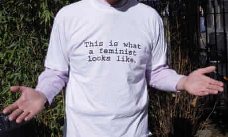 A man wearing a This Is What A Feminist Looks Like T-shirt.