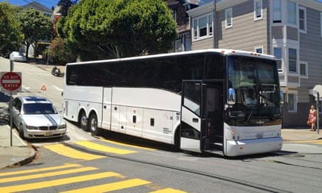 A 'Google bus' gets stuck on a street in San Francisco. 