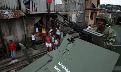 A Colombian soldier patrols in a poor neighbourhood of Buenaventura