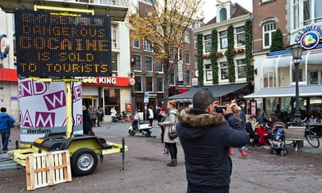 An electronic warning sign in central Amsterdam: 'Extremely dangerous cocaine is sold to tourists.'