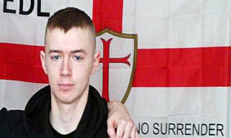 Ryan McGee in front of an EDL flag