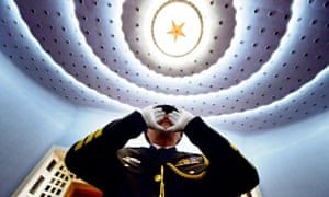 A Chinese People's Liberation Army officer conducts the military band