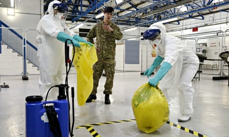 An army medic teaches NHS staff how to dispose of potentially contaminated waste