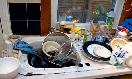 Filthy kitchen sink with dirty dishes to be washed-up