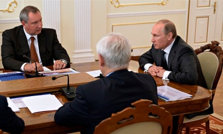 Vladimir Putin and deputy prime minister Dmitry Rogozin, left