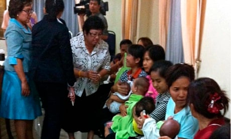 Thai nannies holding surrogate babies, Bangkok