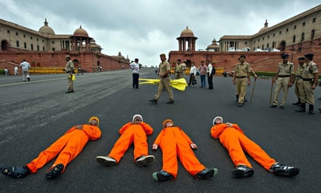 Greenpeace activists dressed as coal miners protest againstin New Delhi